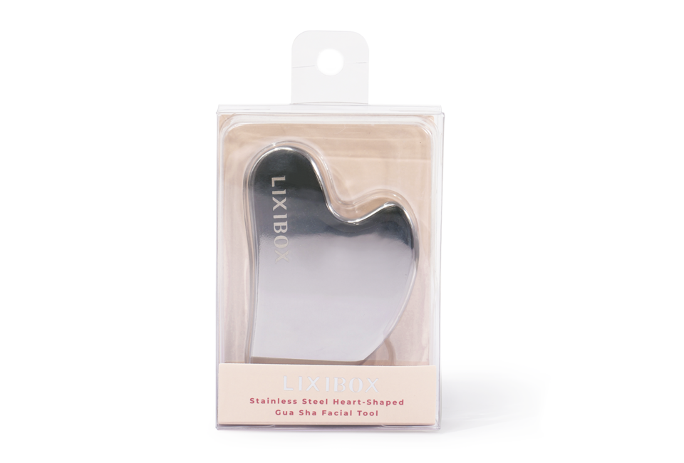 Dụng cụ Massage Mặt Hình Trái tim Lixibox Stainless Steel Heart-Shaped Gua Sha Facial Tool trong bao bì tinh tế với thiết kế đẹp mắt, hoàn hảo cho việc chăm sóc da mặt và thư giãn.