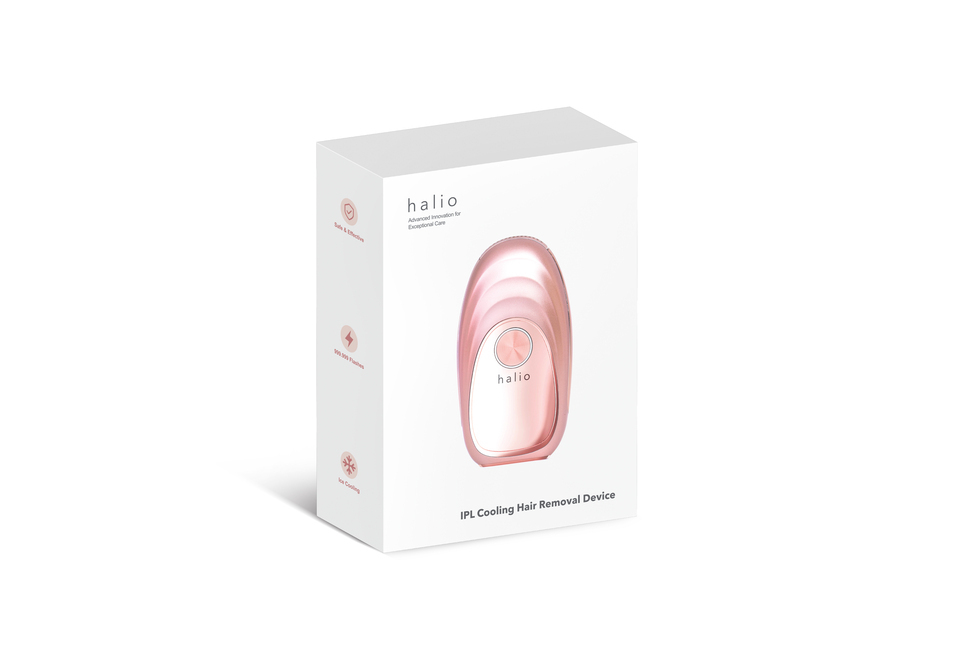 Máy Triệt Lông Lạnh Cá Nhân Halio IPL Cooling Hair Removal Device trong bao bì màu trắng và hồng, hiển thị nhãn an toàn và hiệu quả, sử dụng công nghệ IPL hiện đại cho việc triệt lông hiệu quả và thoải mái.