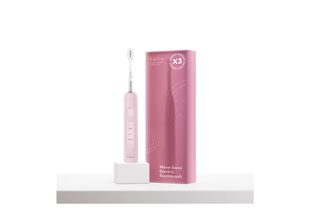 Bàn chải điện tích hợp công nghệ chuyển động kép Halio Wave Sonic Electric Toothbrush - Pink Whisper, thiết kế hiện đại với màu hồng nhạt, kèm hộp sản phẩm. Chứa các chức năng làm sạch, làm trắng và chăm sóc.