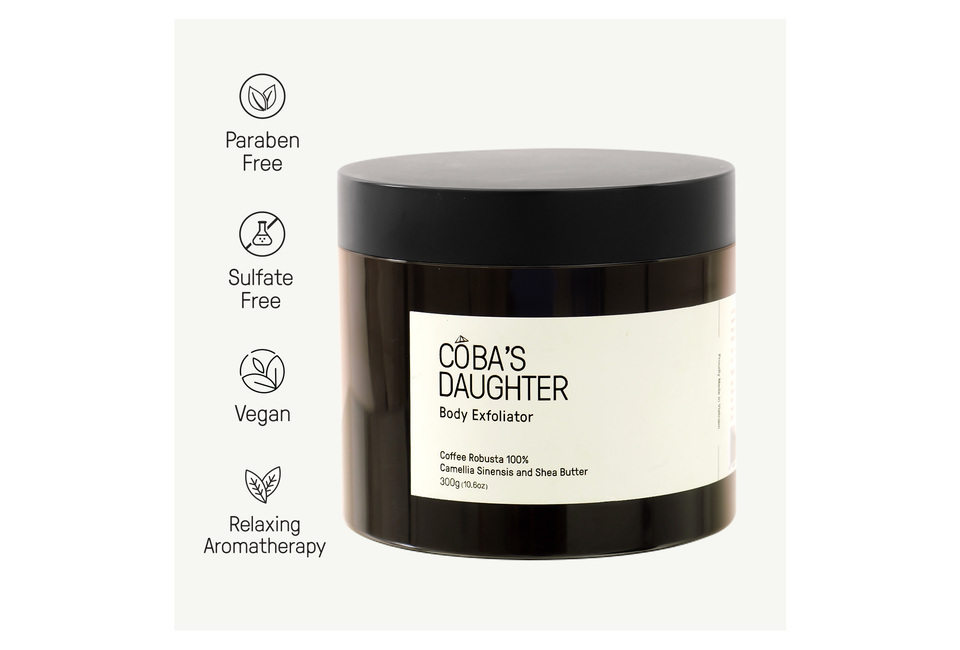 CoBa’s Daughter Body Exfoliator 300gr, featuring a blend of Coffee Robusta 100%, Camellia Sinensis, and Shea Butter. Paraben free, sulfate free, and vegan, with relaxing aromatherapy benefits for a luxurious skincare experience.