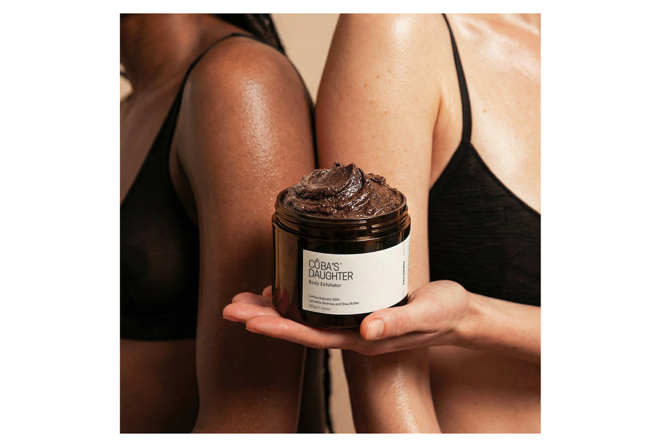 CoBa’s Daughter Body Exfoliator 300gr, a rich coffee scrub showcasing a blend of natural ingredients like vitamin E and shea butter, held by models highlighting smooth skin benefits.