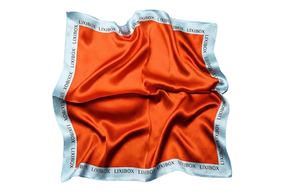Khăn Lụa Lixibox Sundate Energy Silk Scarf với gam màu cam nổi bật, viền satin xanh nhạt, hoàn hảo cho trang phục thêm phần thanh lịch và thời trang.